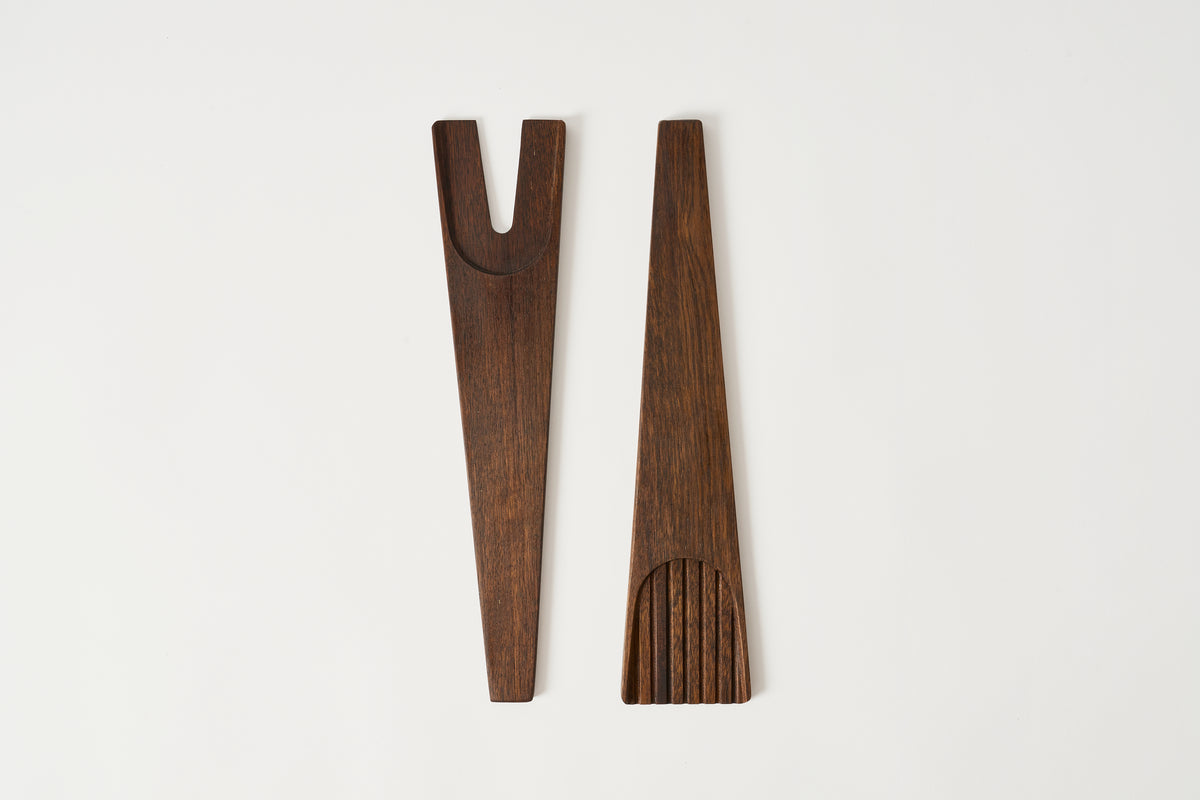 Two wooden tools on a white background