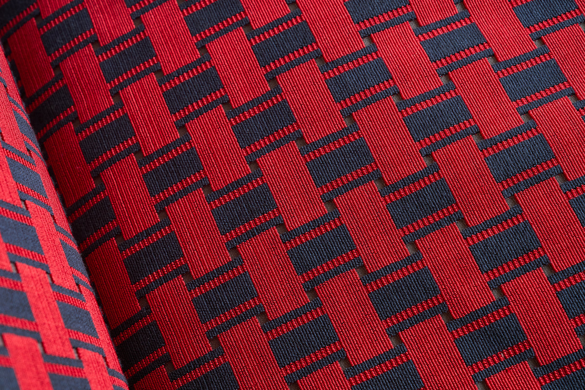 Close-up of red and navy geometric patterned fabric