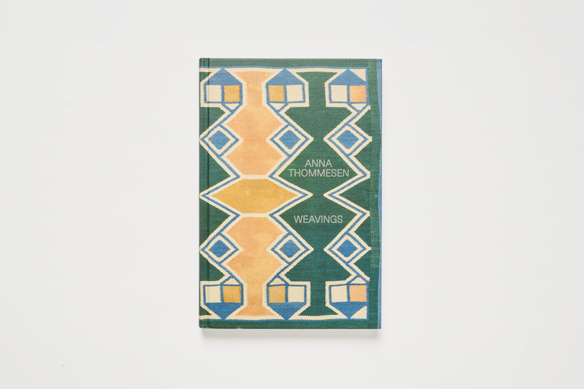 A book titled 'Weavings' by Anna Thomassen, featuring a geometric cover design in green, mustard yellow, and blue on a white background.