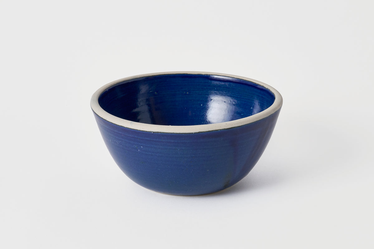 Blue ceramic bowl on a white background