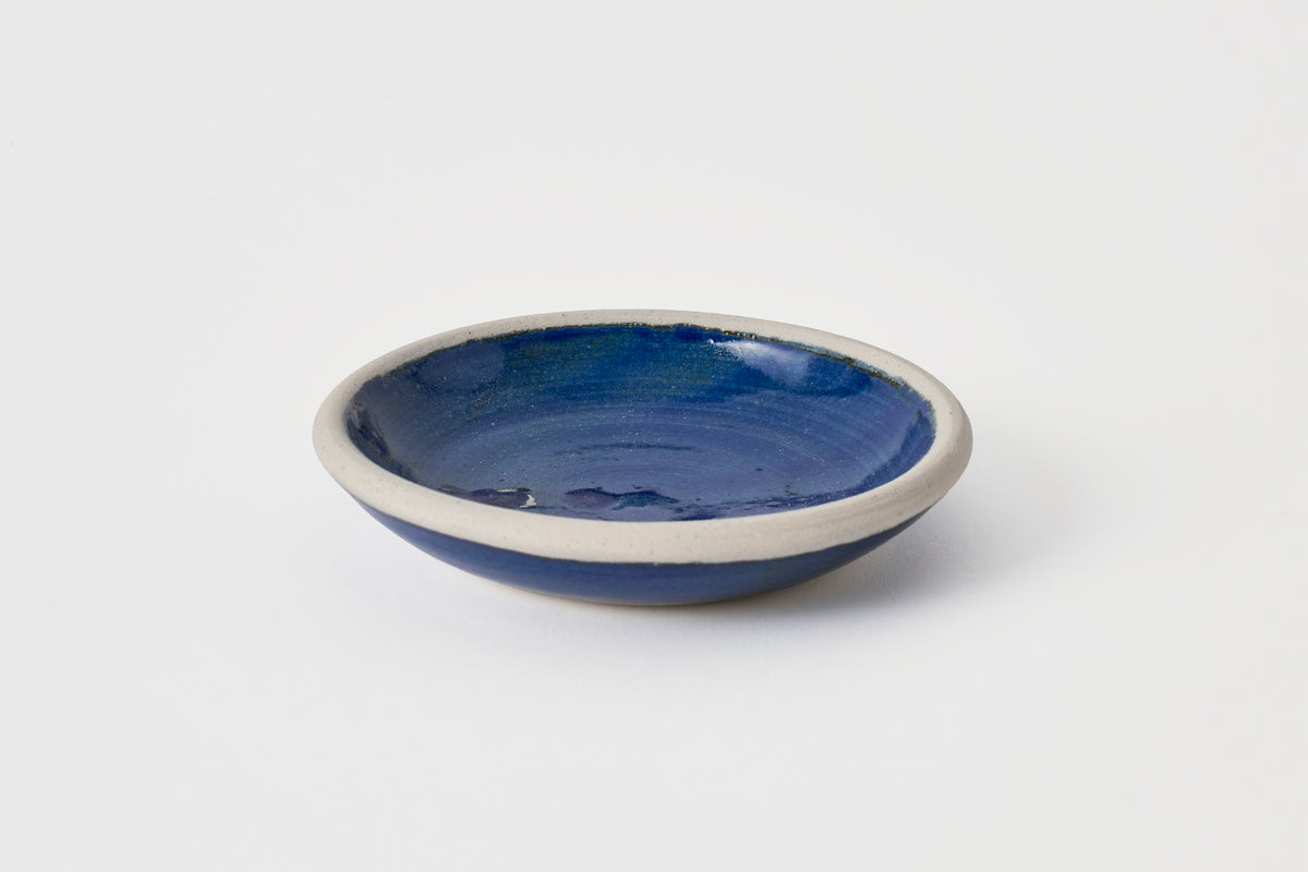 Blue ceramic bowl on a white background