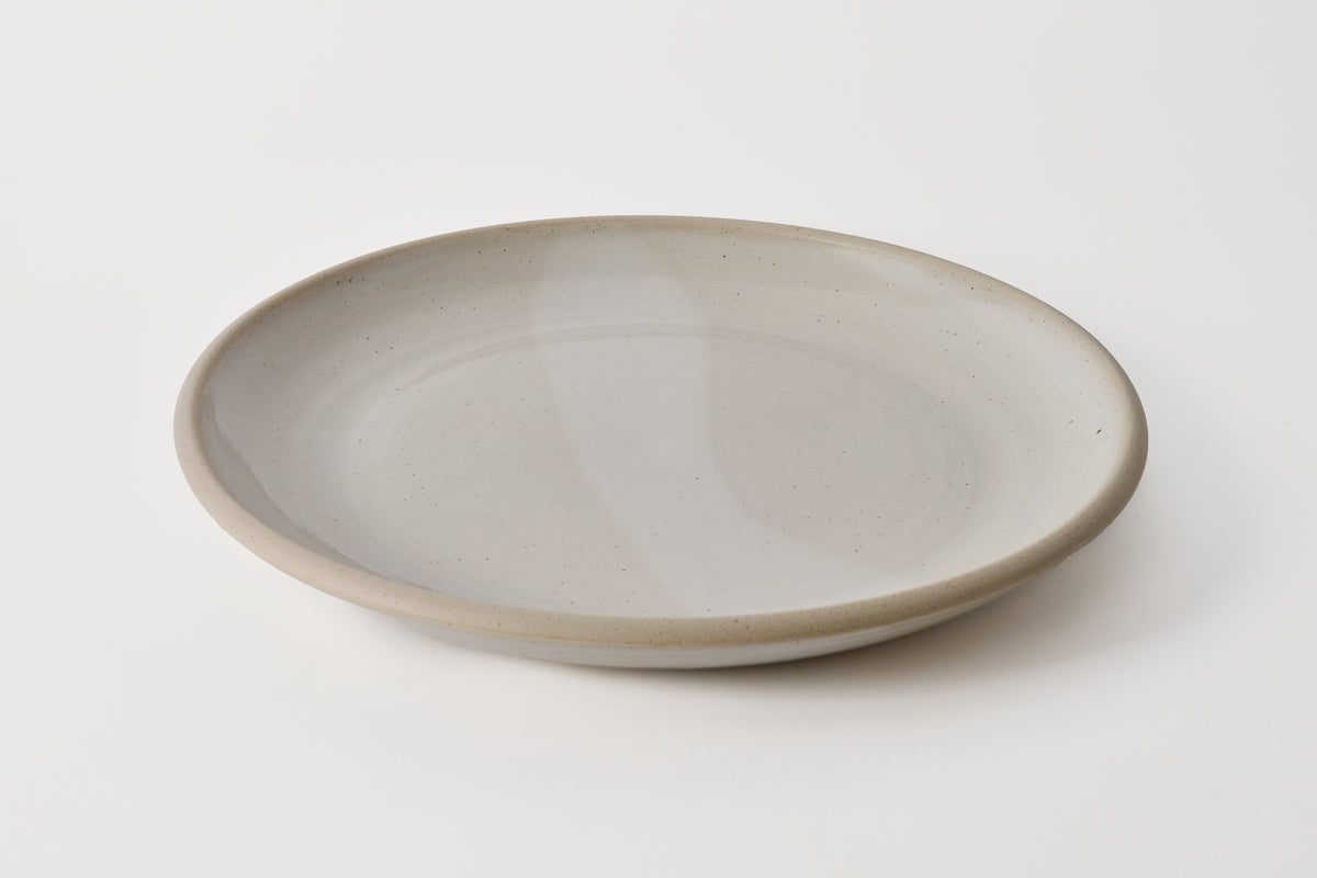 Gray ceramic plate on a white background