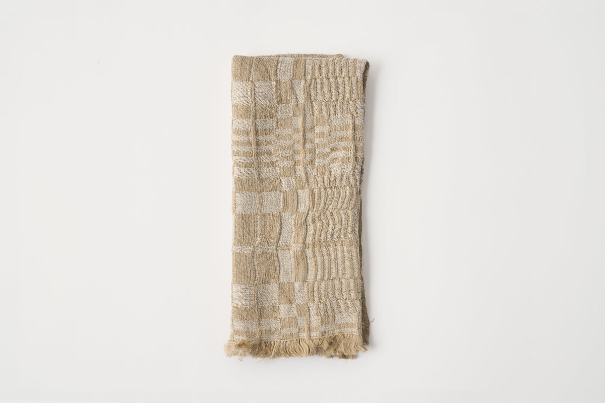 Textured fabric napkin on a white background