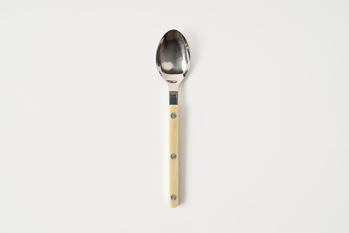 Spoon with a wooden handle on a white background