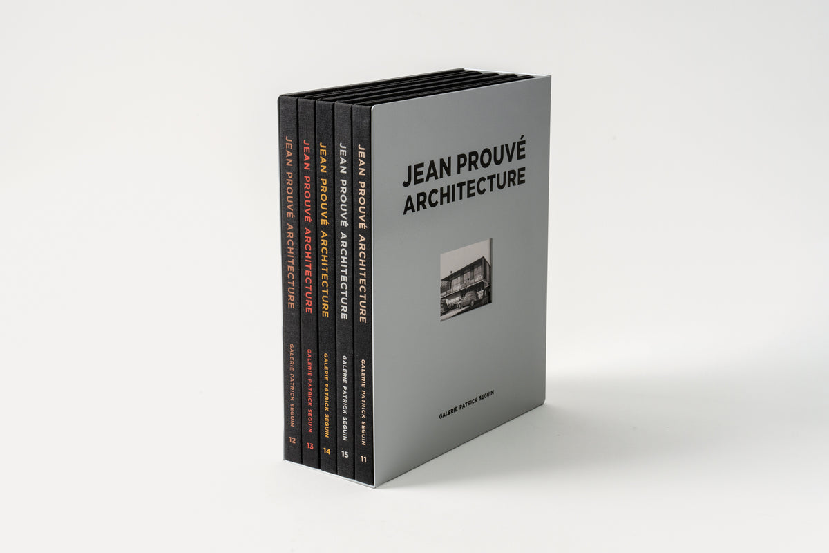 A boxed set of five books titled 'Jean Prouè Architecture', featuring a gray cover with the title and author's name.