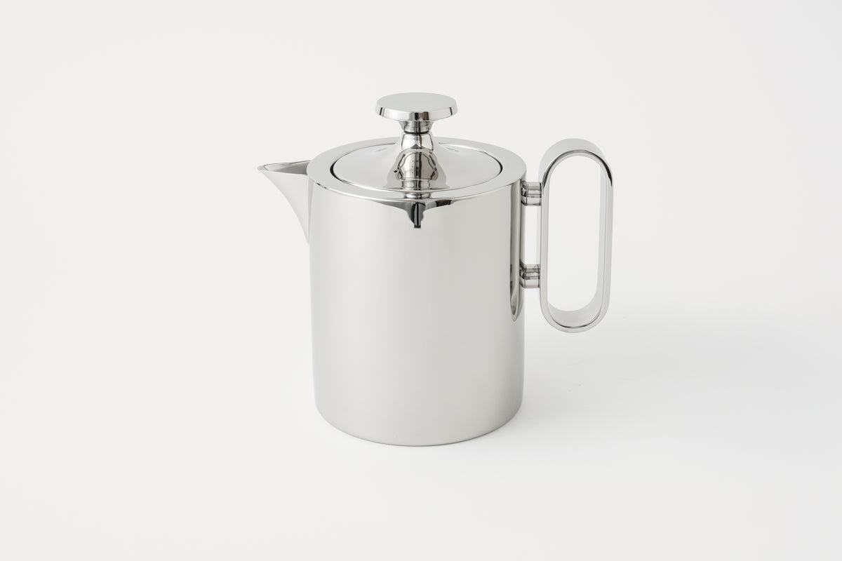 A polished stainless steel teapot with a lid and handle, displayed against a white background.