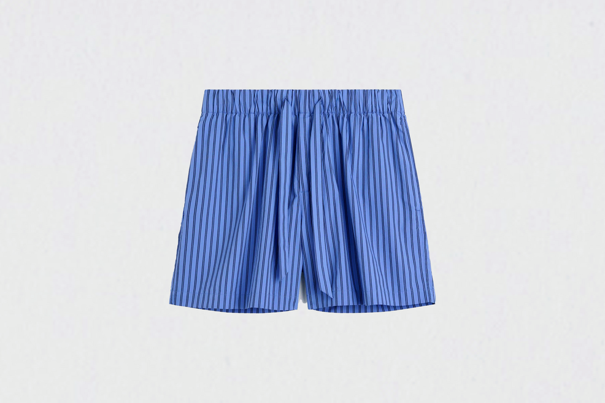 Blue striped shorts on a light gray background