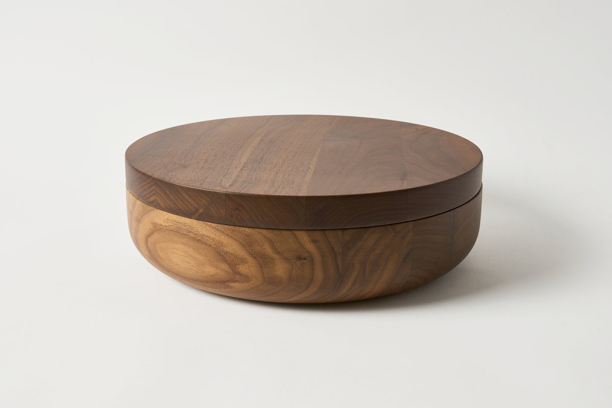 Wooden box with a lid on a white background