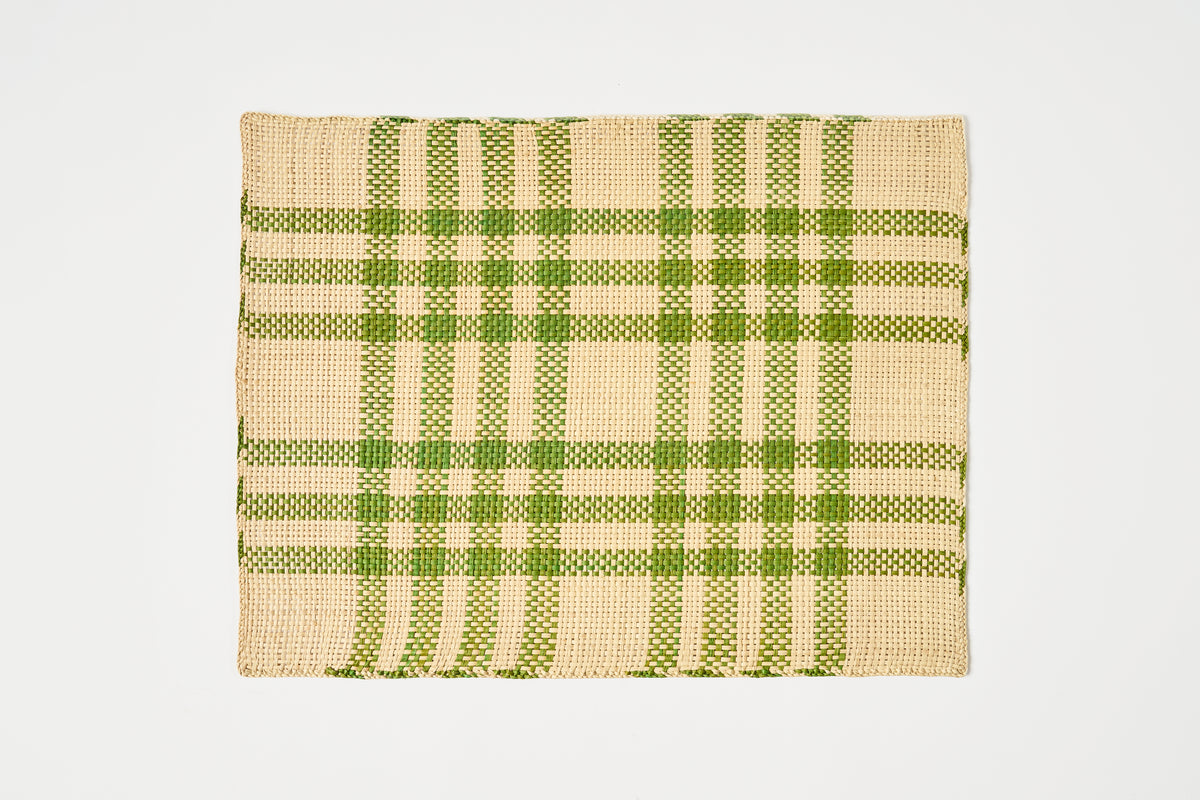 A rectangular woven placemat with a green and beige plaid pattern, shown flat against a light gray background.
