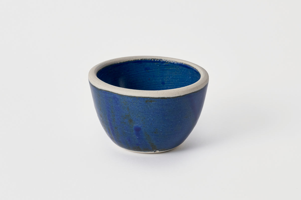 Blue ceramic bowl on a white background