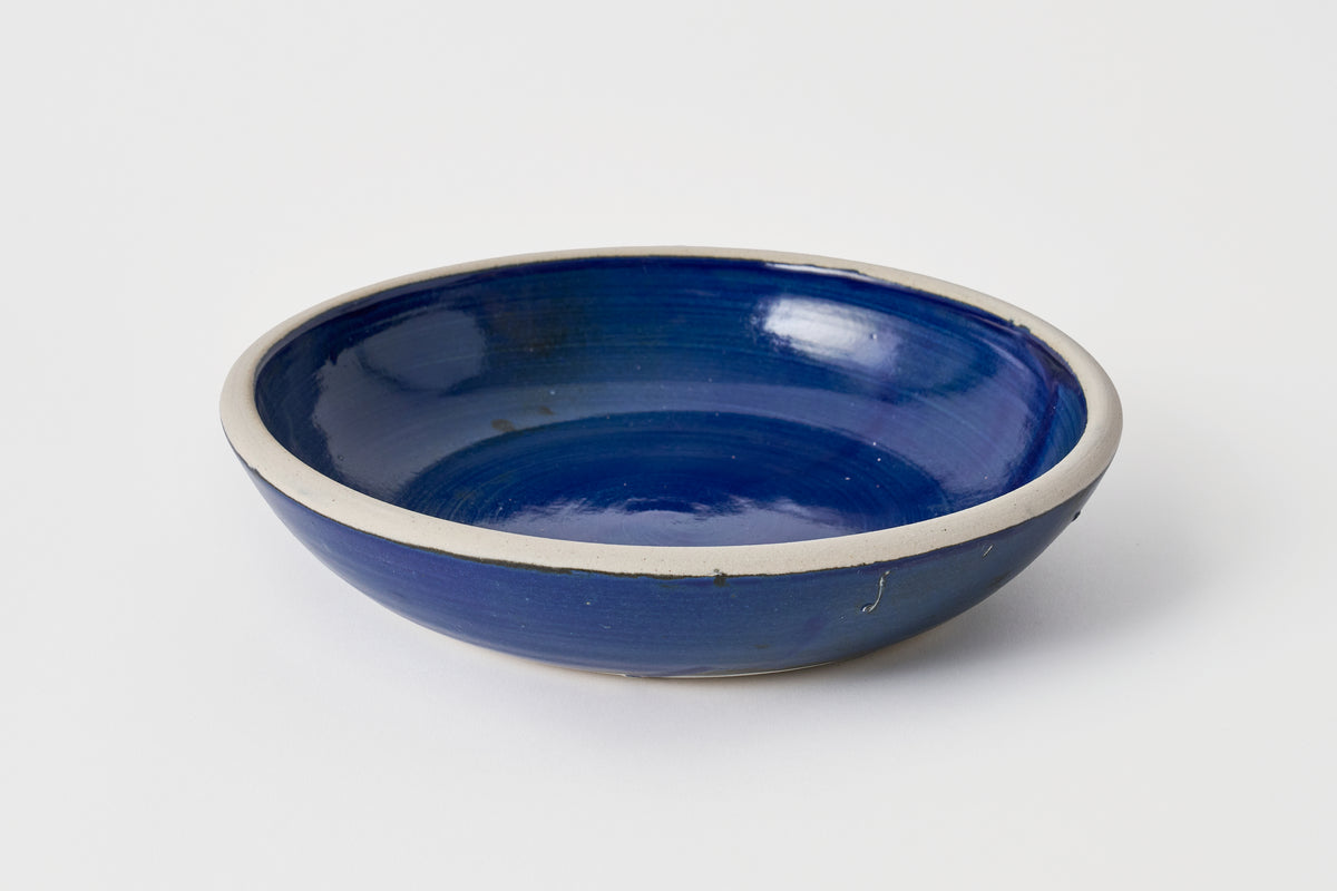 Blue ceramic bowl on a white background