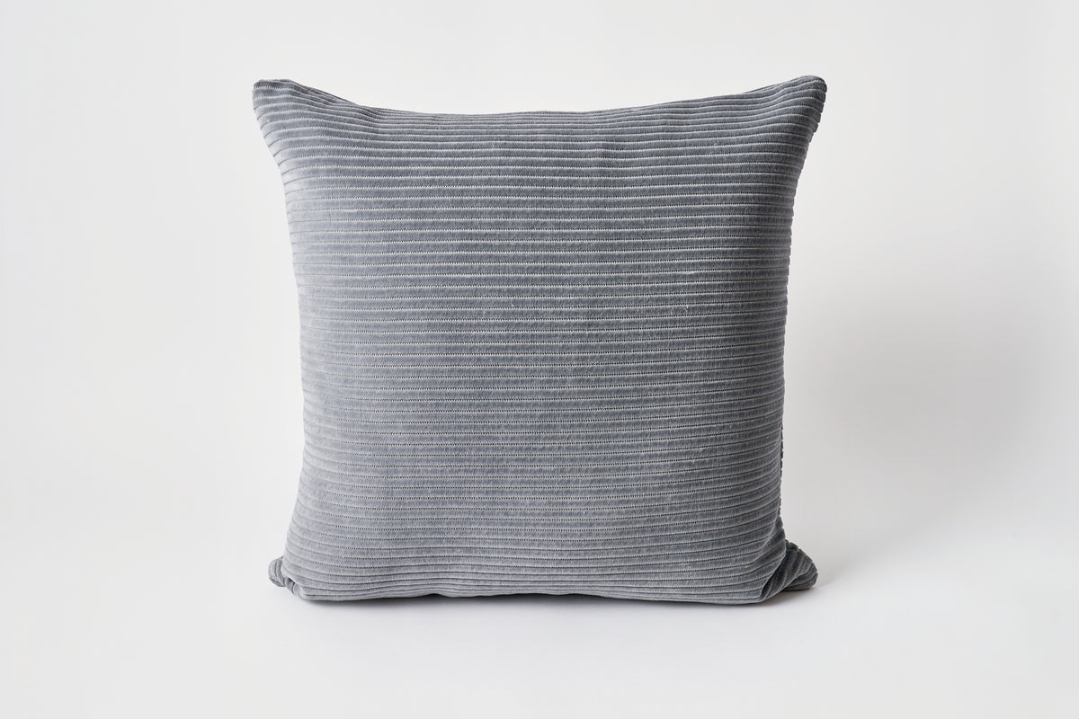 Gray striped pillow on a white background