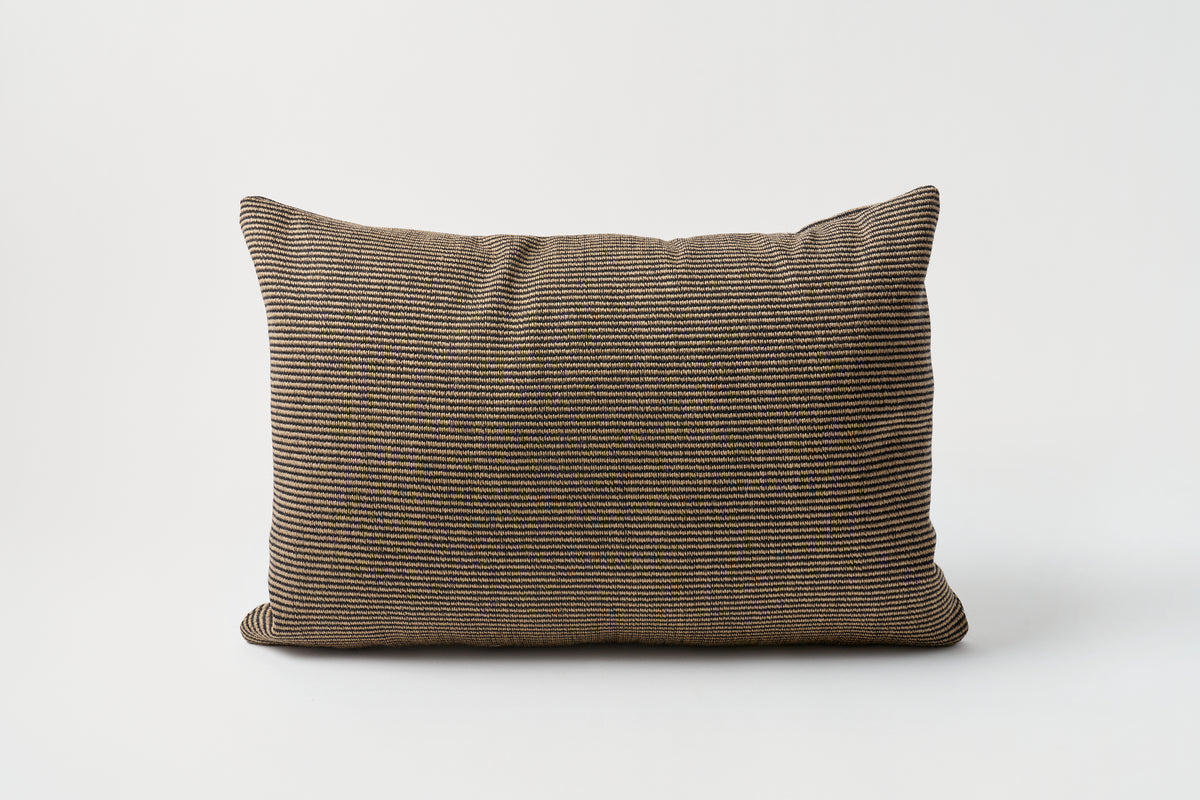 Brown textured pillow on a white background