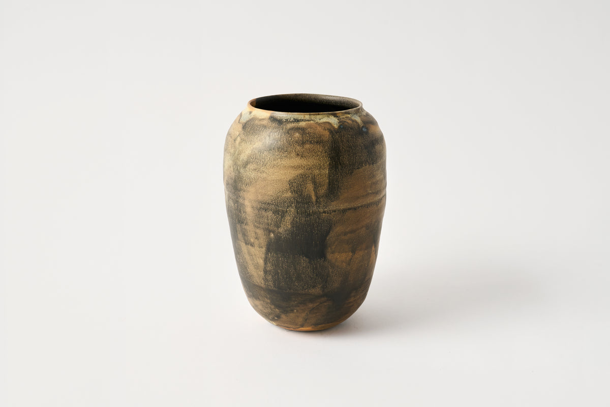 Brown ceramic vase on a white background