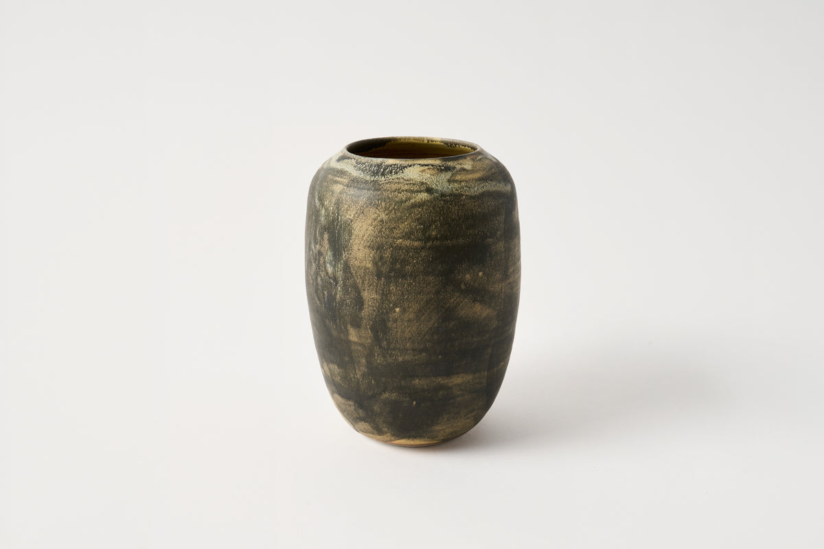 Dark brown ceramic vase on a white background