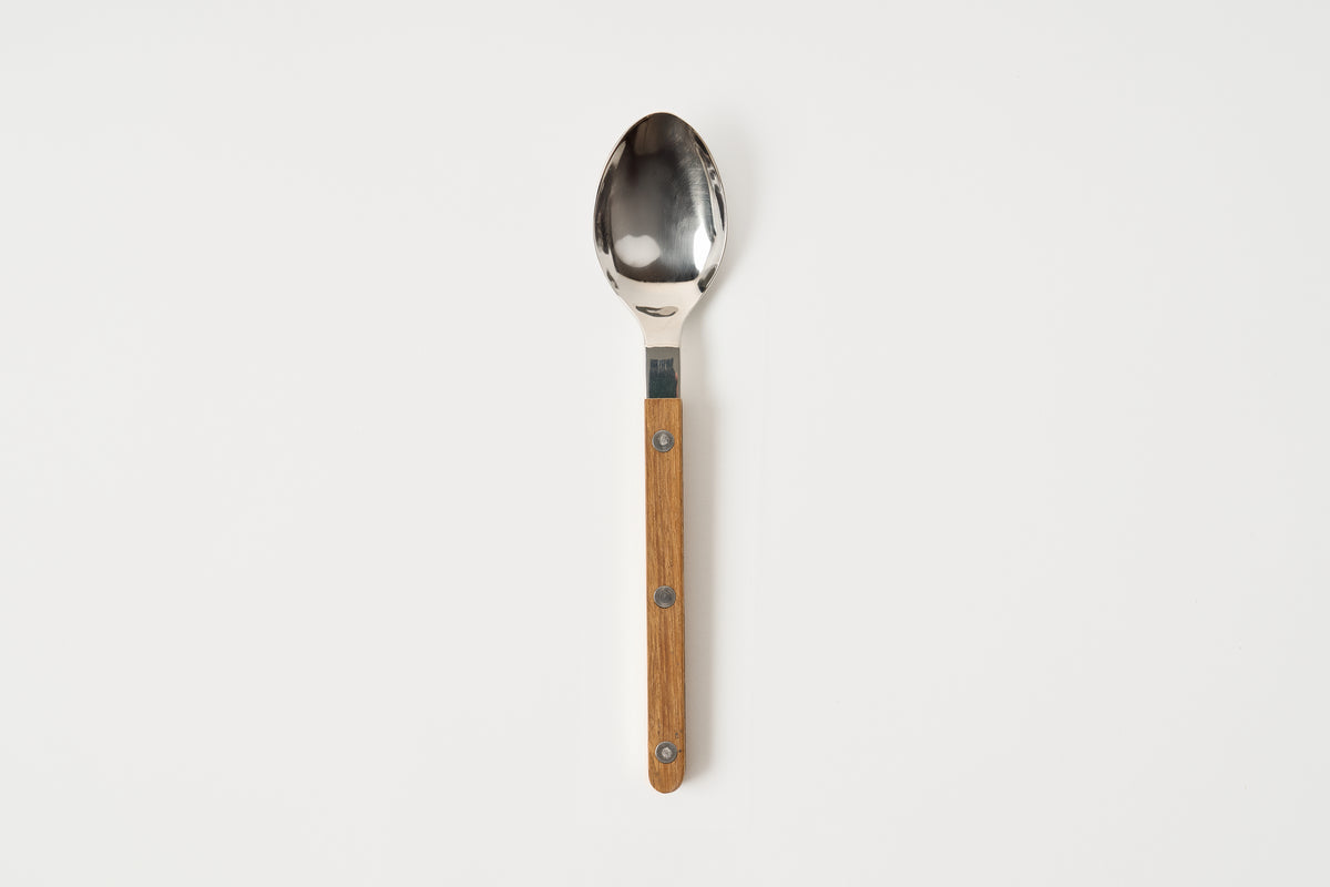 Spoon with wooden handle on a white background